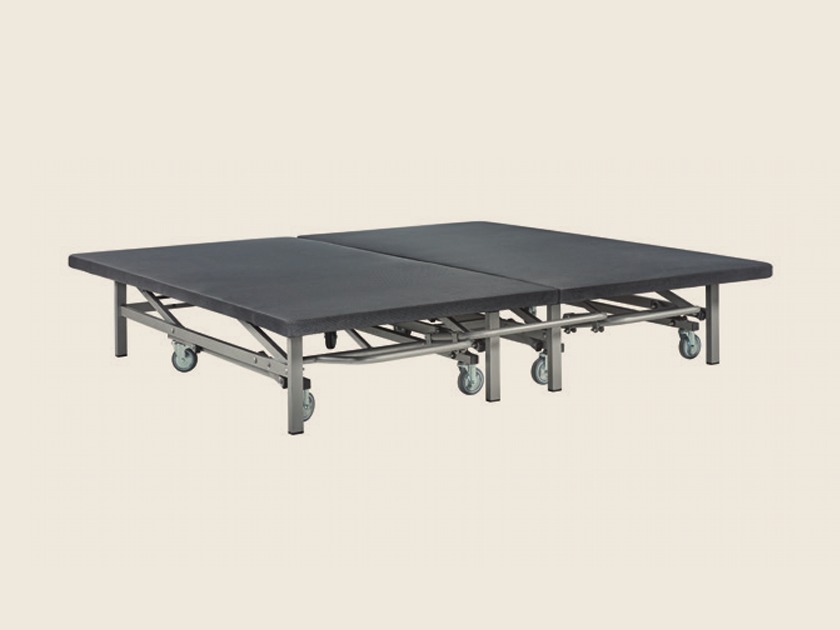 Dos bases de cama elevable individuales, unidas para formar una sola cama doble.
